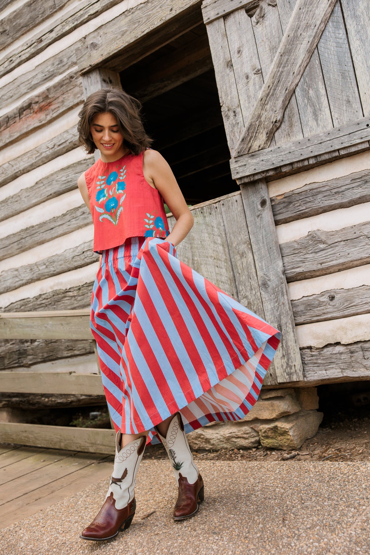 Model wearing Livro Cinnaleaf crop top, full front view with floral print.