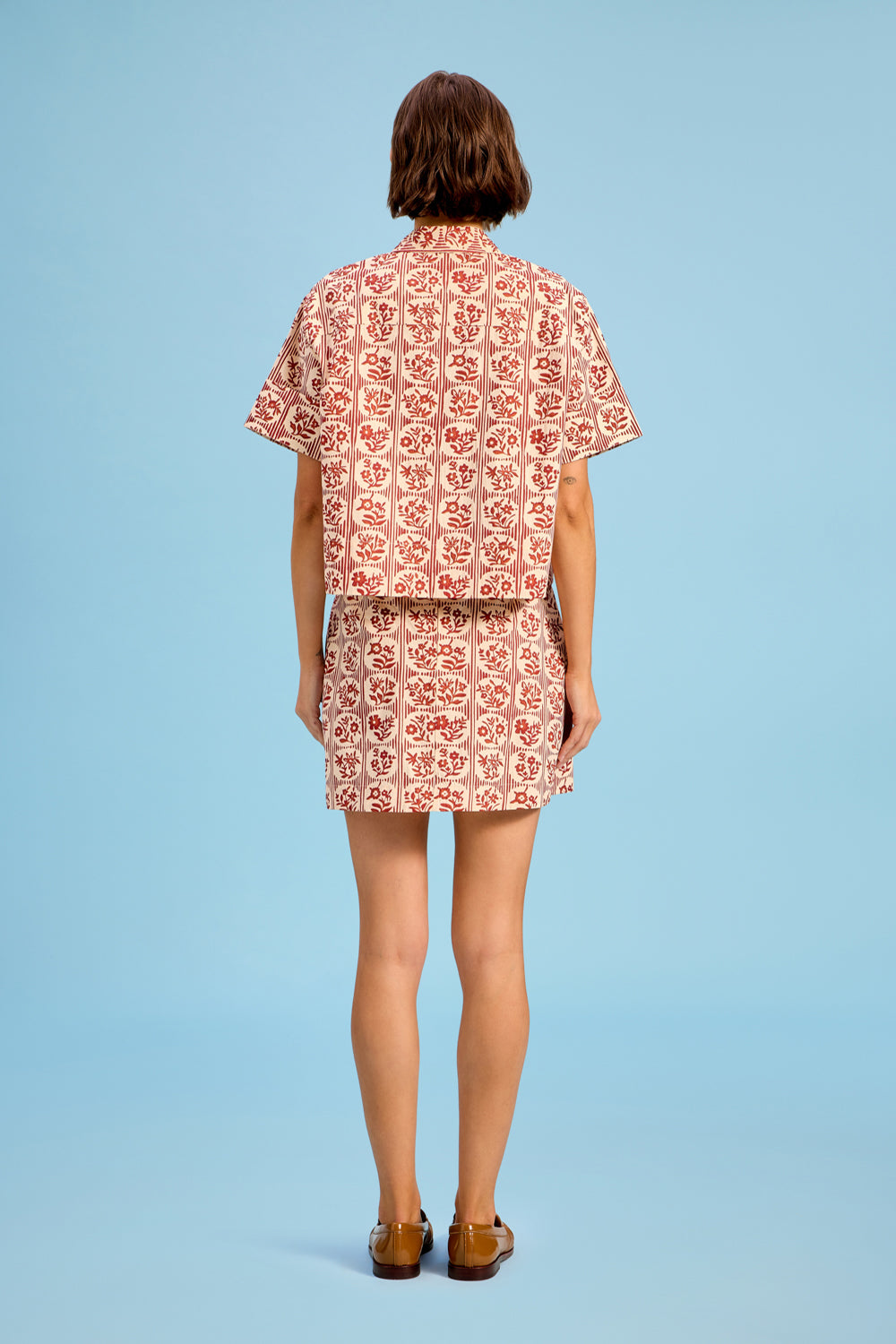 Model wearing Livro The Mini Skirt in Brick Bloom, alternate view