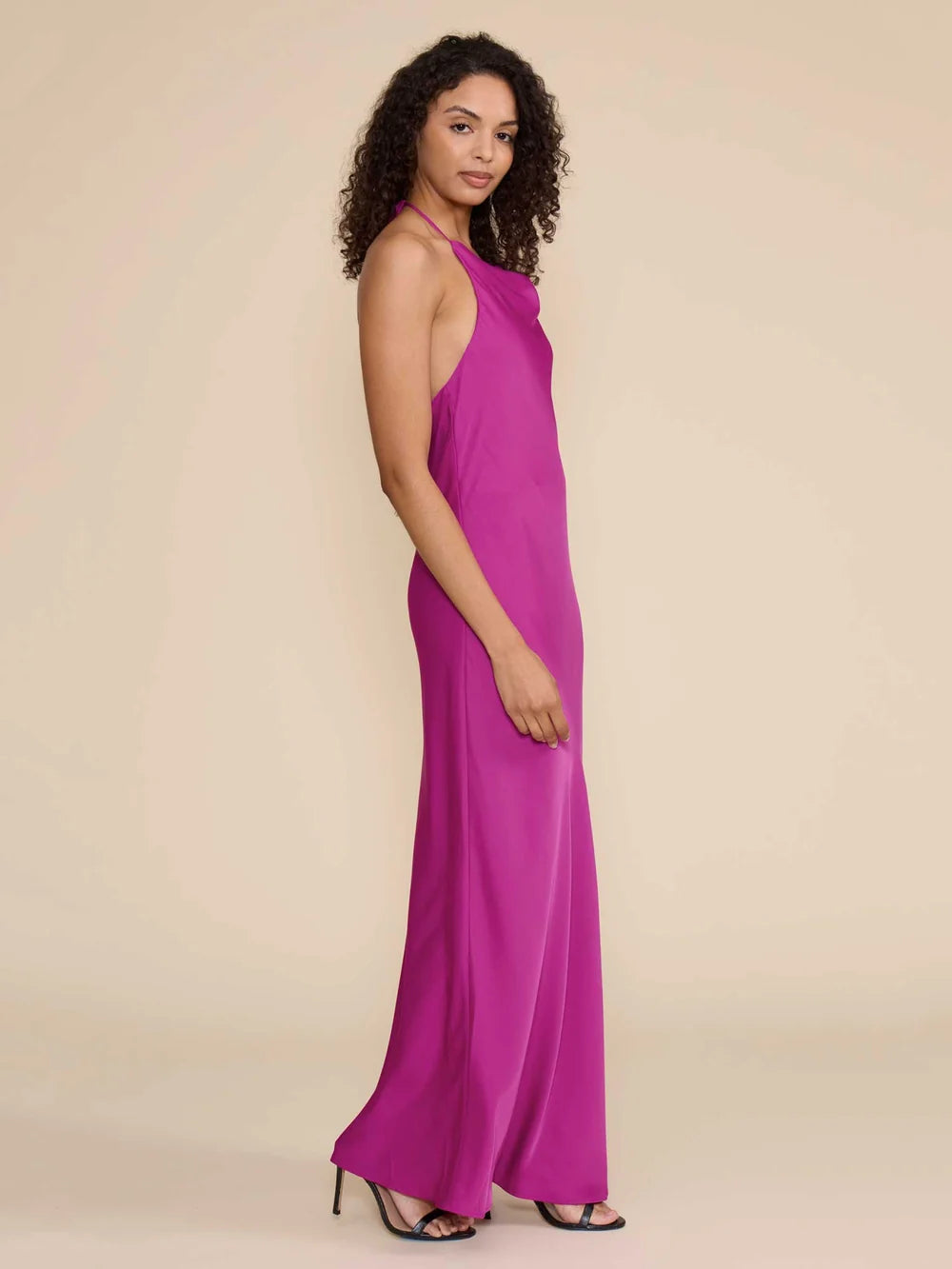 Magenta Aurora dress side view showing fluid maxi silhouette
